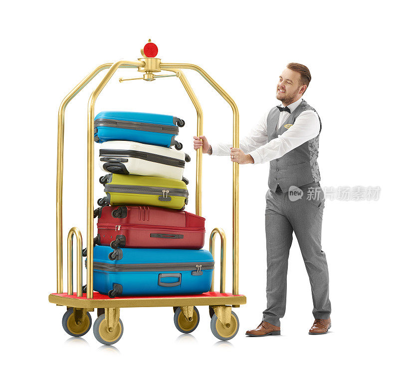 酒店工作人员推着一堆行李