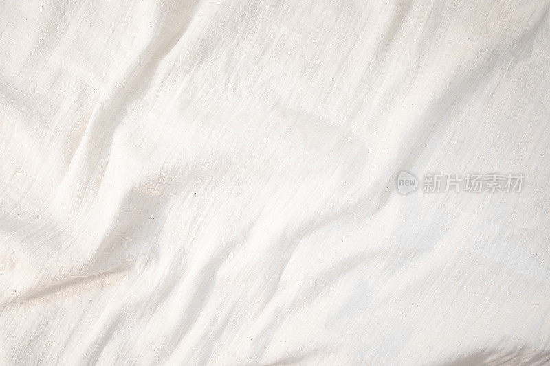 织物背景白色亚麻帆布皱巴巴的天然棉织物天然手工亚麻俯视图背景有机生态纺织品白色织物纹理