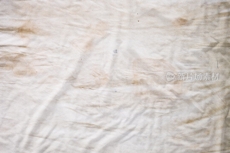顶视图床上用品床单或白色织物褶皱纹理背景