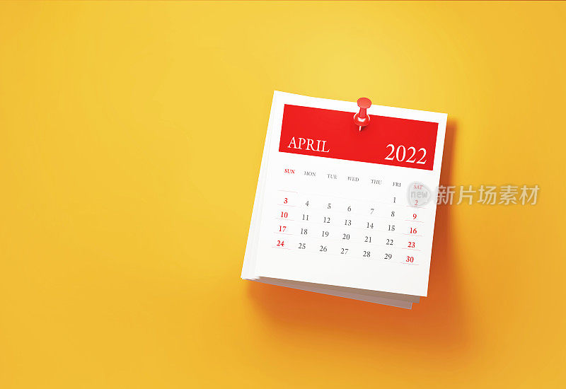 将2022年4月日历贴在黄色背景上