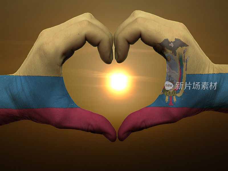 心形和爱的手势用手在厄瓜多尔国旗上着色