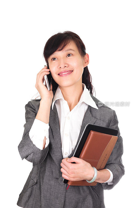 亚洲商业女性在电话孤立