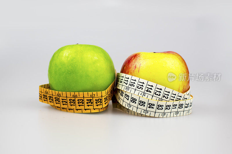 饮食的概念。苹果卷尺