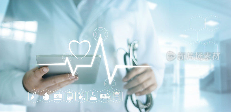 医生使用数字平板电脑与医疗图标和心跳在医院背景
