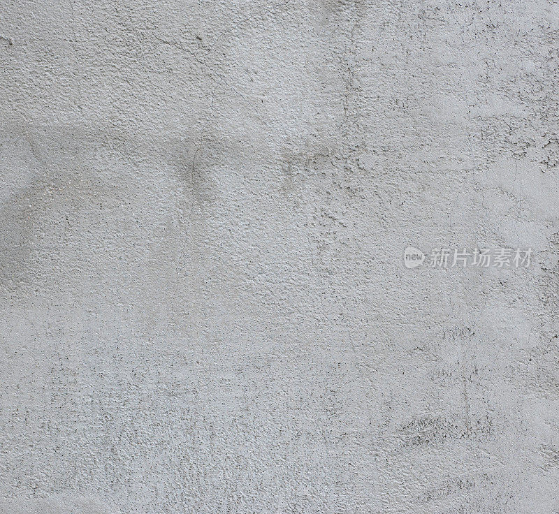 白色的墙壁，纹理不均匀。