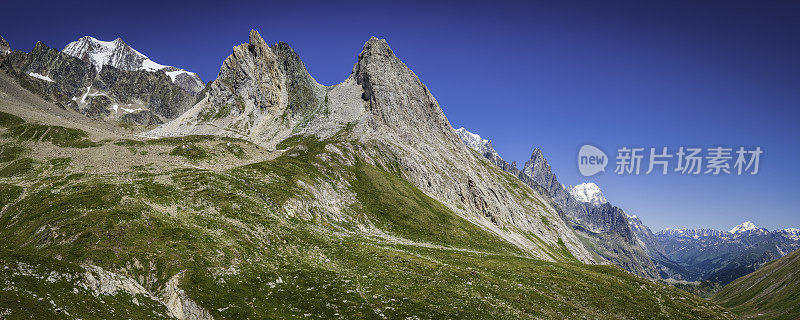 绿山草甸小径下面的岩石山峰全景阿尔卑斯山