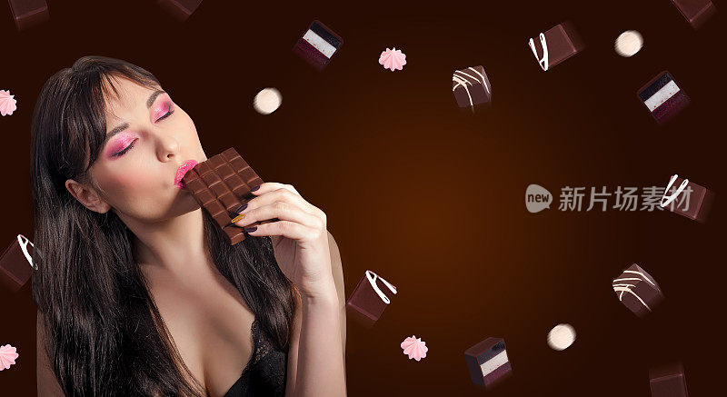 女人和巧克力。美丽的年轻女子正在吃巧克力背景巧克力。