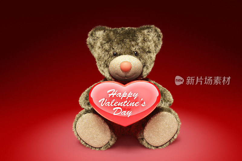 可爱的泰迪熊抱着红色的心