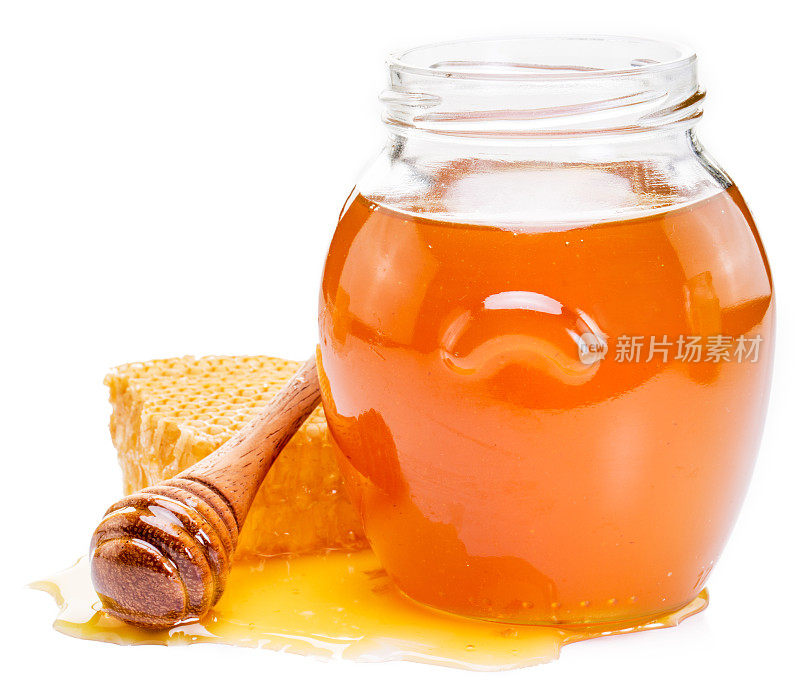罐子里装满了新鲜的蜂蜜和蜂窝。