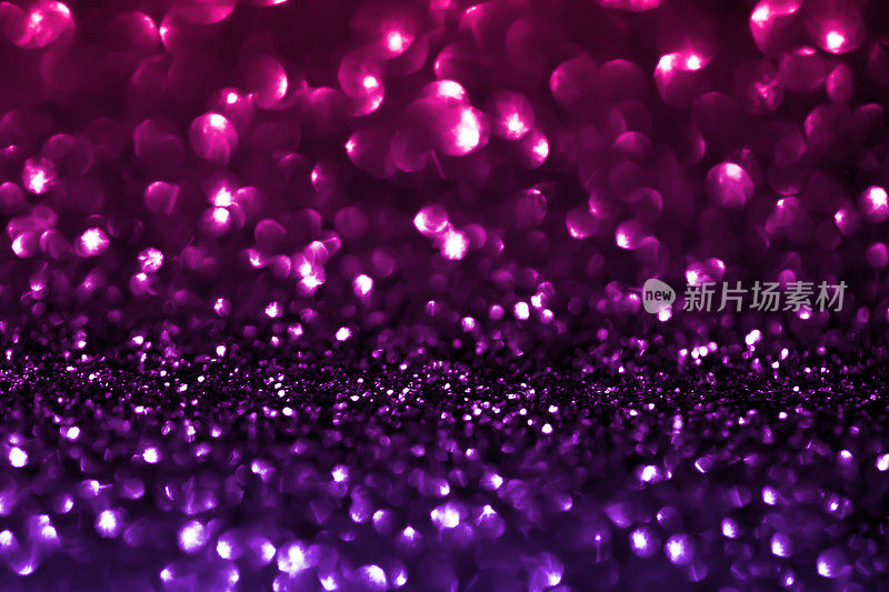 紫色闪光渐变散景灯背景假日图案热粉色紫外线圈圣诞灯亮片尘埃气泡粒子豪华纹理微距摄影