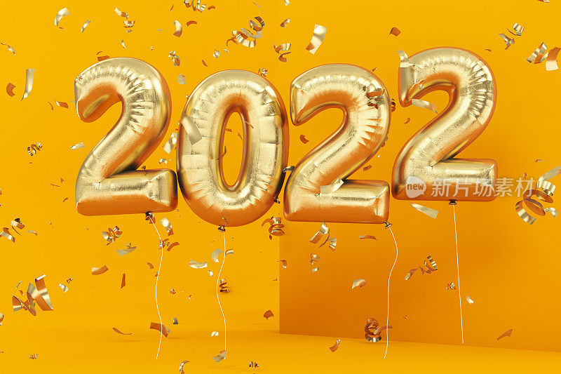 2022金色气球和黄色纸屑的新年概念