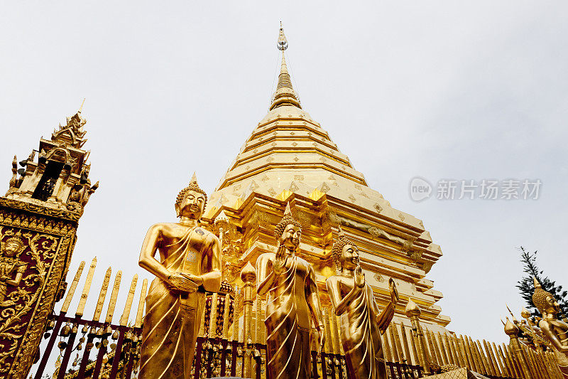 泰国佛寺的金佛雕像和宝塔