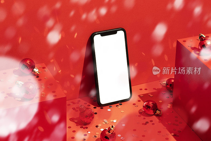 智能手机模型，红色圣诞背景下的纸屑雨模板