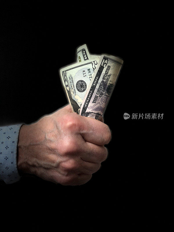 经济刺激:牵着美元的手，黑色背景