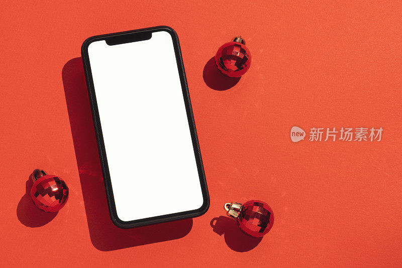 智能手机模型，红色背景的圣诞球模板