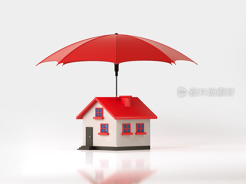 红色伞保护一个玩具房子在白色的背景:保险和房地产概念