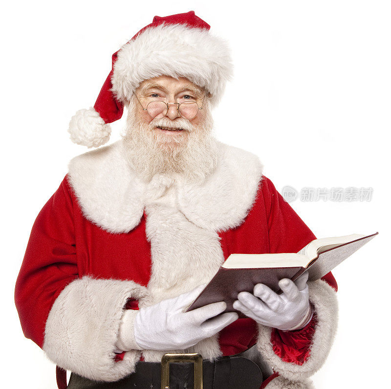 真正的圣诞老人在读一本书的图片