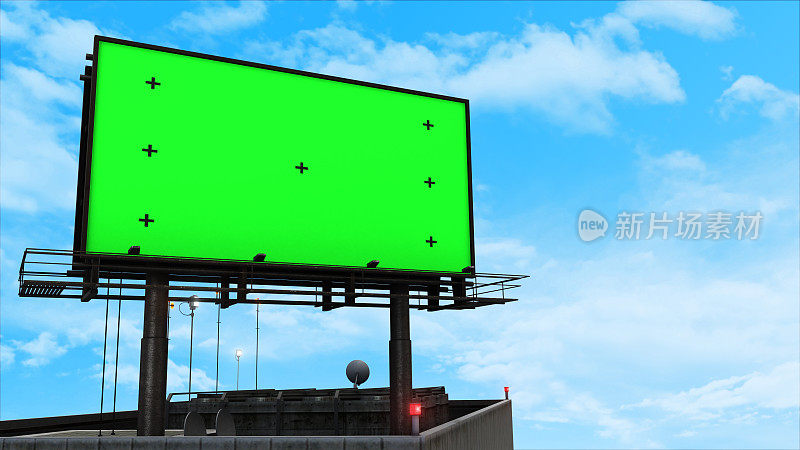 建筑物顶部的大型绿色屏幕广告牌