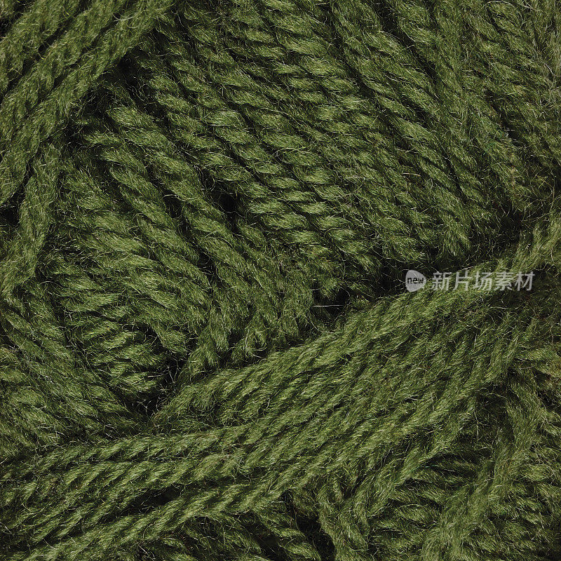 天然绿色细羊毛丝线质地，微细纹理提示宏观特写