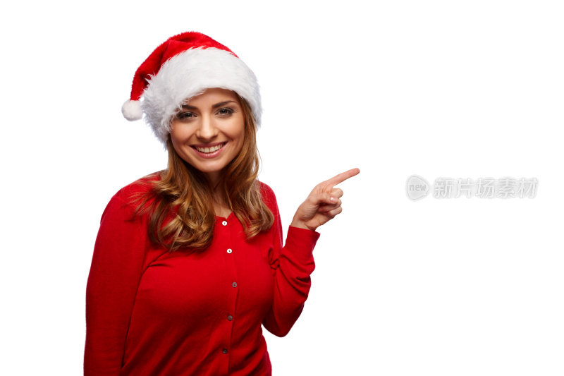 戴着圣诞老人帽的年轻美女指着文案
