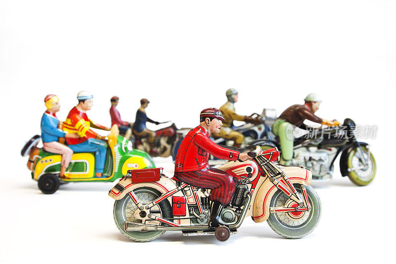 一组彩色收藏古董锡玩具摩托车骑手。