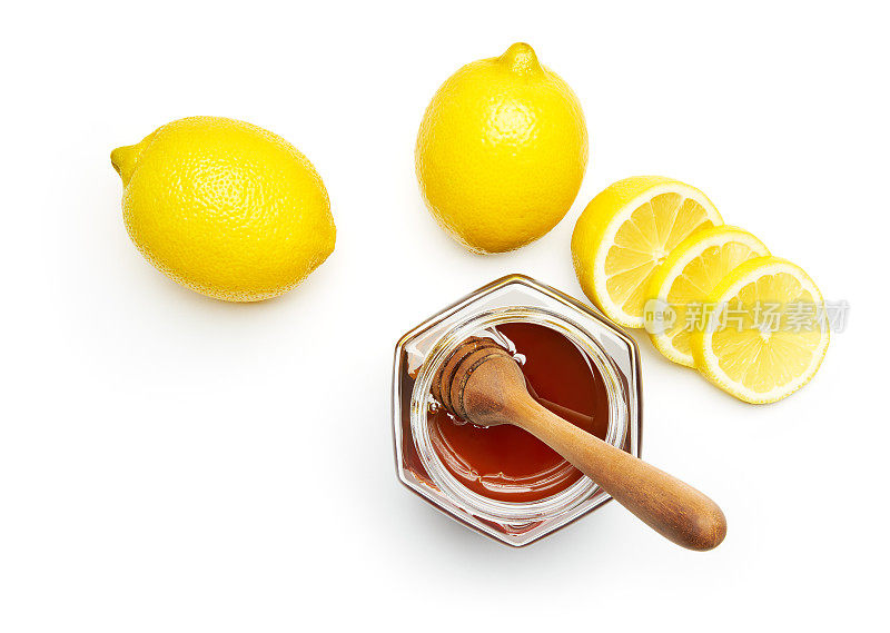 蜂蜜和新鲜柠檬在白色的背景