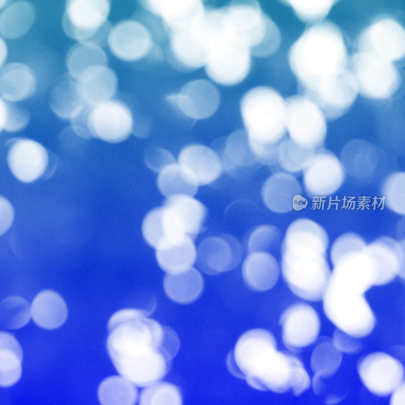 抽象的蓝色散景，圣诞和新年主题背景