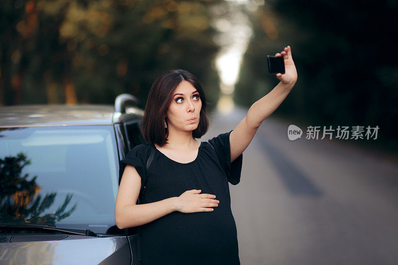 怀孕女性旅行者在汽车旅行中自拍