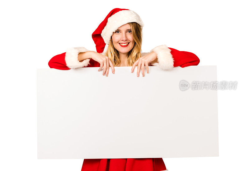 穿着圣诞老人服装的女人拿着一块白板
