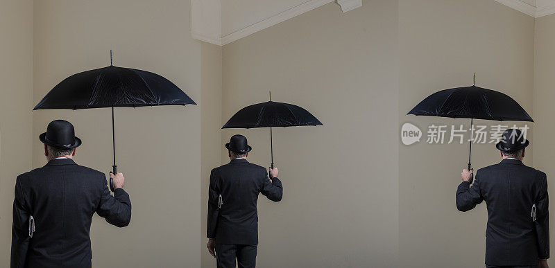 英国人戴着圆顶硬礼帽，打着黑色雨伞。