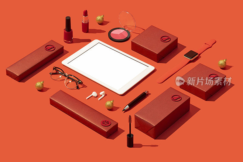 数码平板模型，模板上红色背景与红色彩妆礼盒，化妆品平铺。