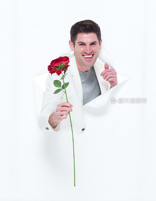 穿白西装的帅小伙破纸而出，手捧一朵玫瑰