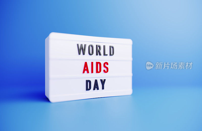 世界艾滋病日书写的白色灯箱坐在蓝色背景上