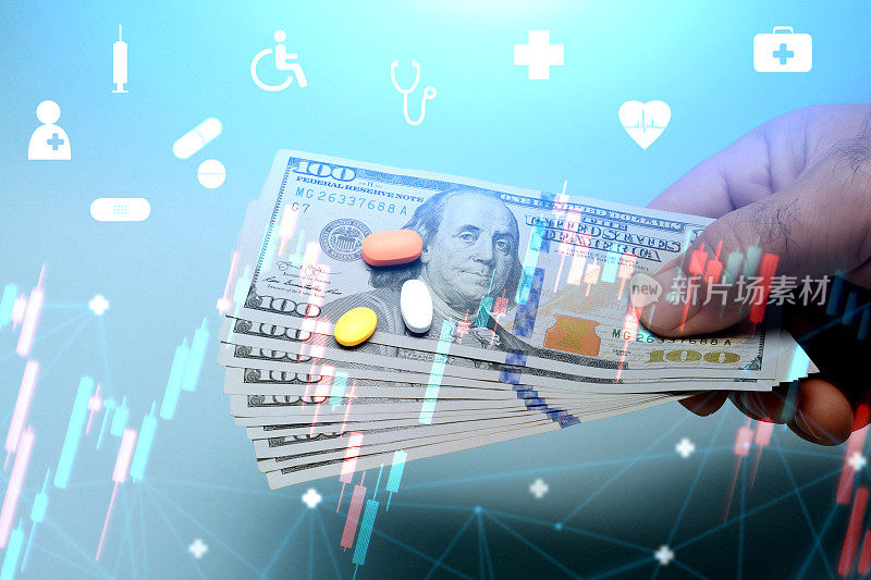 医疗保健和医疗成本概念。手里拿着美元，上面有金融数据和医疗图标