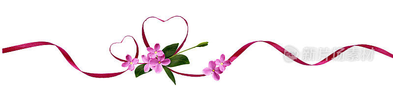 粉色的绸带心形和小鲜花是情人节的礼物