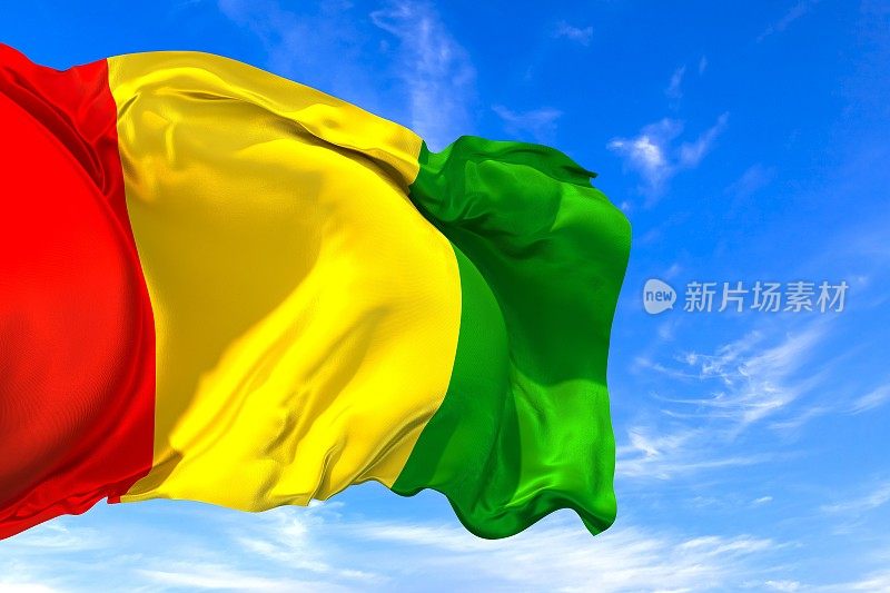 几内亚国旗在蓝天上迎风飘扬