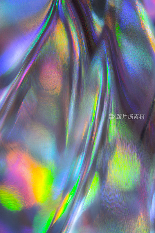 抽象生动的彩色图案。偏振光透过玻璃结构观看。动感缤纷的艺术背景。