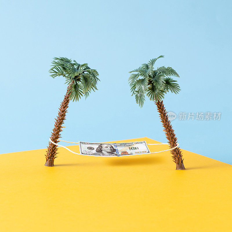 画着棕榈树和一张像吊床一样的钞票的静物画。休闲、度假、旅游理念