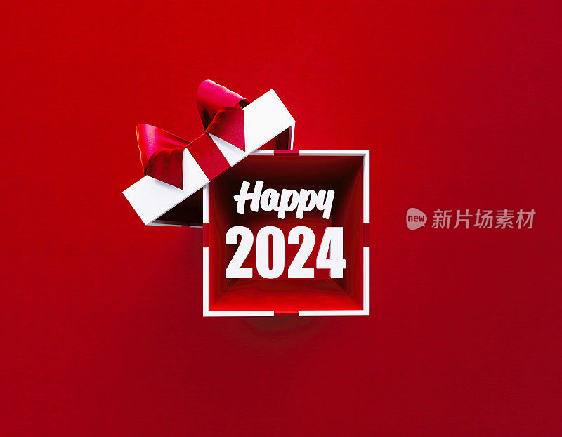 快乐的2024字从系着红丝带的白色礼盒里出来