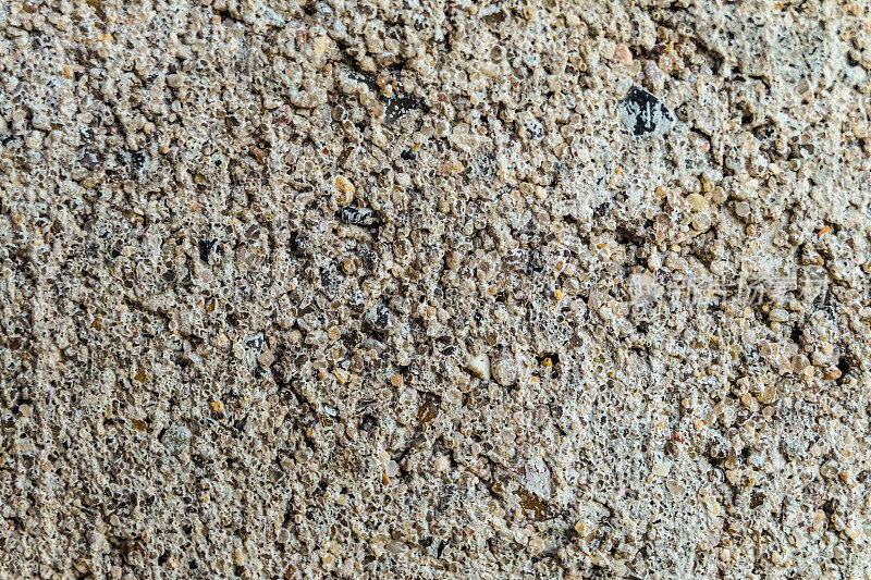 表面纹理硅酸盐饰面石特写。混凝土沙粒。