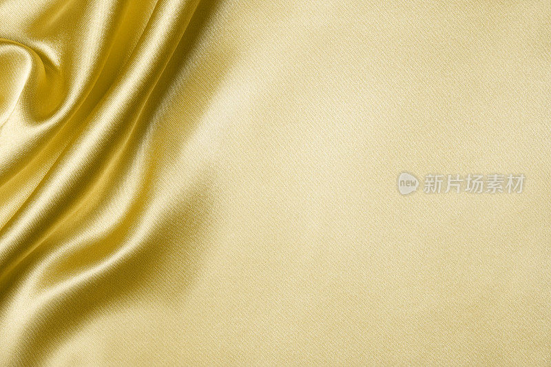 金色丝绸波浪纹理背景