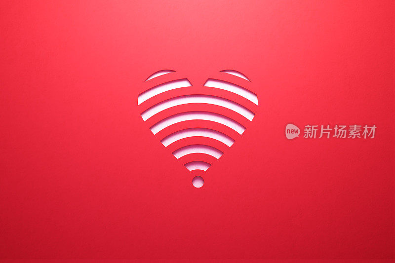 在线约会和短信概念——白色Wi-Fi标志，类似于一个心形坐在红色背景上