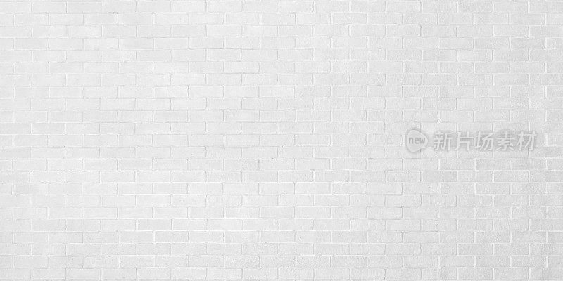 白色的砖墙背景纹理为石砖砌块，背景上绘有灰色浅色壁纸和现代室内外设计