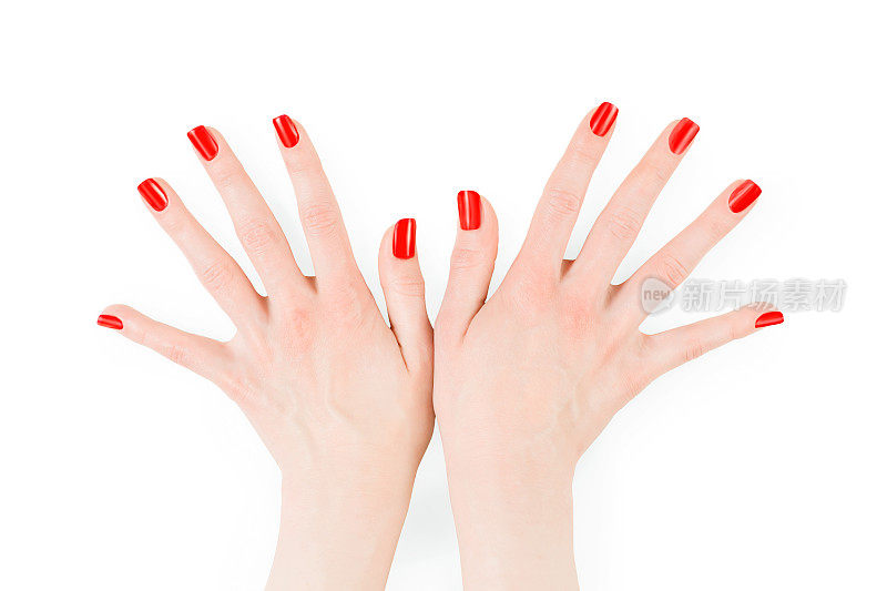 女人的手涂着完美的亮红色指甲油
