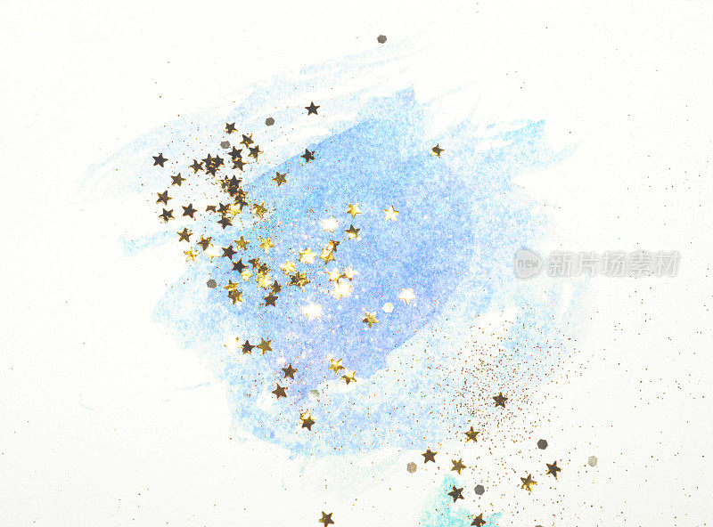 金色的闪光和闪闪的星星在抽象的蓝色水彩中飞溅怀旧的色彩