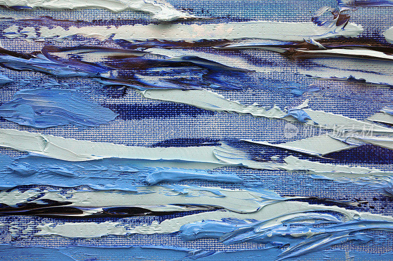 在白色画布上抽象混乱随意的点点蓝色油画。Simpe背景概念