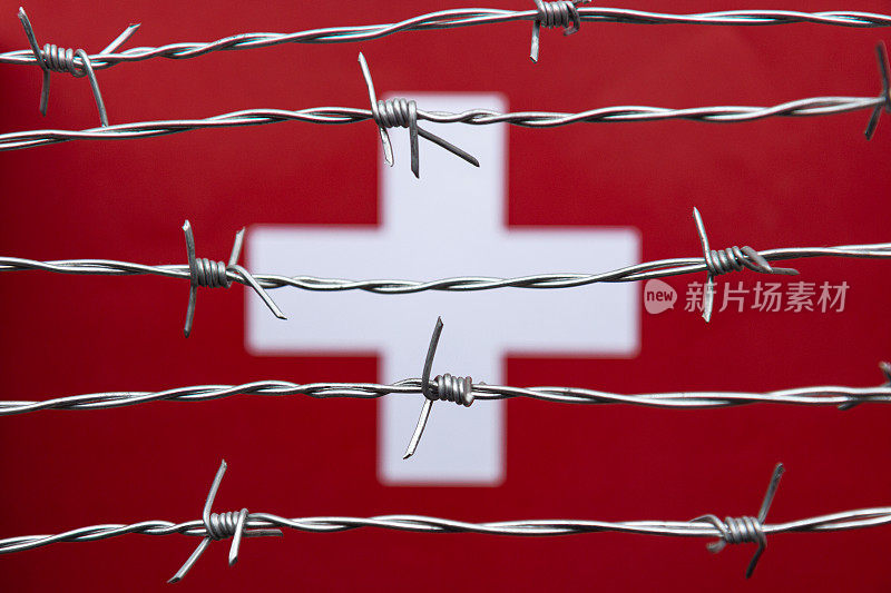 瑞士国旗和铁丝网
