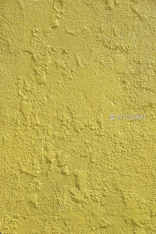 芥末黄色灰泥墙纹理背景