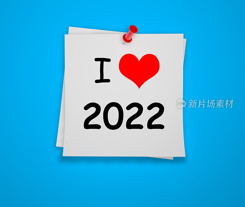 我喜欢2022年的文字便利贴和蓝色背景上的红色图钉