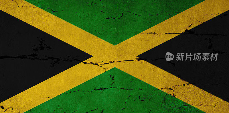 牙买加国旗挂在开裂的墙上